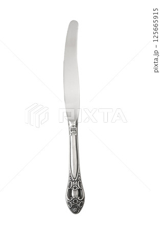 Elegant silver butter knife with intricate handle design, antique kitchenware collections on white background Elegant silver butter knife with intricate handle design, antique kitchenware collections on white background 125665915