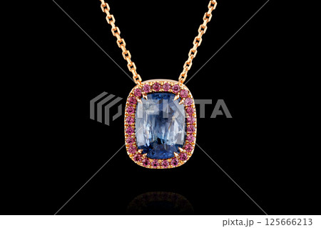 gold pendant with sapphire stone and diamonds on black background gold pendant with sapphire stone and diamonds on black background 125666213