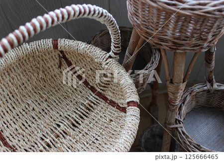 Variety handicraft baskets made from braided willow twigs 125666465