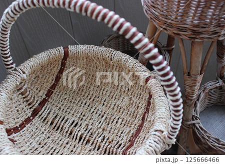 Technique of handmade wicker pots and baskets from braided twigs 125666466