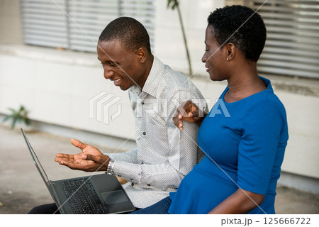 Close up of young people with laptop. 125666722
