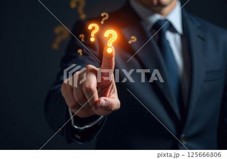 Male finger touches one of many question marks flying in air. Brainstorming and problem-solving. 125666806