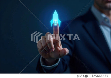 Businessman touching on blue rocket icon launch with up arrow, investment growth, financial success. 125666845
