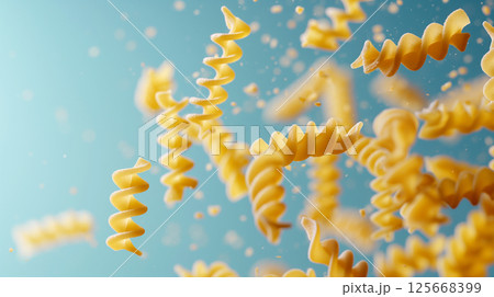 Dynamic closeup of uncooked fusilli pasta spirals as gourmet Italian food background Dynamic closeup of uncooked fusilli pasta spirals as gourmet Italian food background 125668399