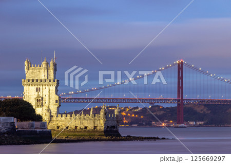 Belem Tower and 25th of April Bridge at Evening Twilight. Lisbon, Portugal 125669297