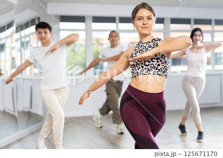 Group of young people dancing jazz funk Group of young people dancing jazz funk 125671170
