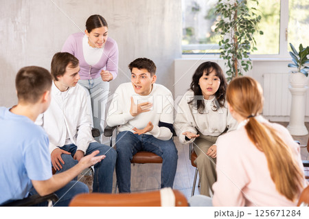 Group of students studying for difficult test in studygroup together Group of students studying for difficult test in studygroup together 125671284