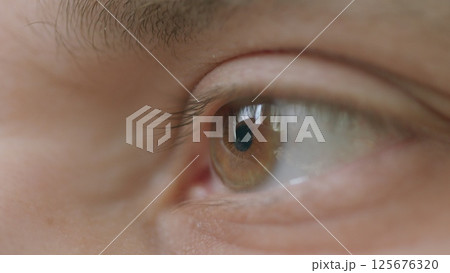 CloseUp of a Human Eye Featuring Stunning Reflection and Intricate Details and Colors CloseUp of a Human Eye Featuring Stunning Reflection and Intricate Details and Colors 125676320