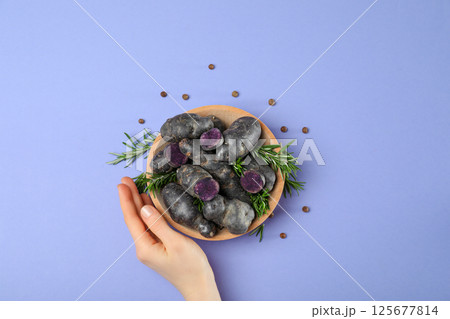 Concept of unusual vegetable - purple potato vegetable Concept of unusual vegetable - purple potato vegetable 125677814