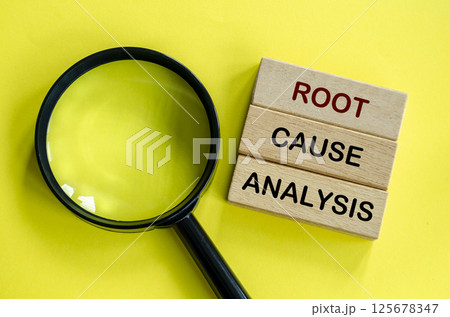 Root Cause Analysis text on wooden blocks with magnifying glass as background. Root cause analysis concept Root Cause Analysis text on wooden blocks with magnifying glass as background. Root cause analysis concept 125678347