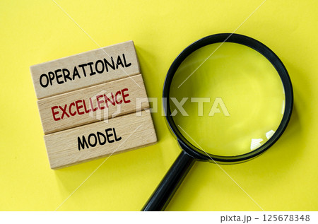 Operational Excellence Model text on wooden blocks with magnifying glass as background. Root cause analysis concept Operational Excellence Model text on wooden blocks with magnifying glass as background. Root cause analysis concept 125678348