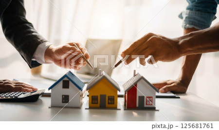 Salesman Hands On House Model , Small Toy House Small Mortgage Property insurance and concepts real estate Salesman Hands On House Model , Small Toy House Small Mortgage Property insurance and concepts real estate 125681761