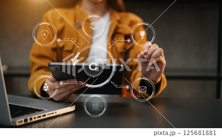 Copyright or patent concept, Person hand using laptop computer, tablet and smartphone with virtual screen copyright icon trademark, Creation ownership against piracy. Copyright or patent concept, Person hand using laptop computer, tablet and smartphone with virtual screen copyright icon trademark, Creation ownership against piracy. 125681881