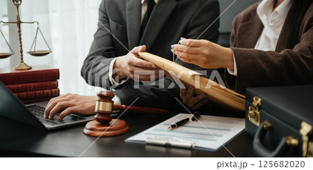 Business and Male lawyer or judge consult having team meeting with client, Law and Legal services concept.Customer service good cooperation in office 125682020