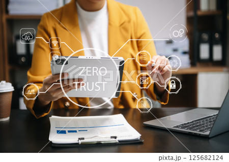 Zero trust security concept Person using computer and tablet with zero trust icon on virtual screen of Data businesses 125682124