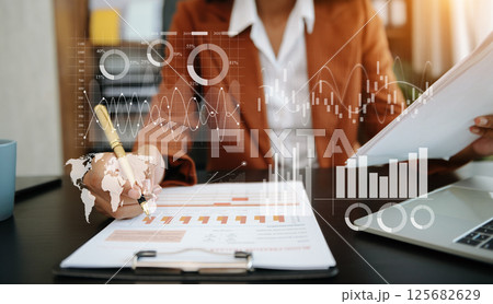 Businessman hand Project manager working and update tasks and Gantt chart scheduling virtual diagram.with smart phone, tablet and laptop Businessman hand Project manager working and update tasks and Gantt chart scheduling virtual diagram.with smart phone, tablet and laptop 125682629