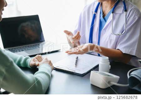 Psychology, depression. Suffering asian old woman, consulting with psychologist, psychiatrist while patient counseling mental problem. Psychology, depression. Suffering asian old woman, consulting with psychologist, psychiatrist while patient counseling mental problem. 125682678