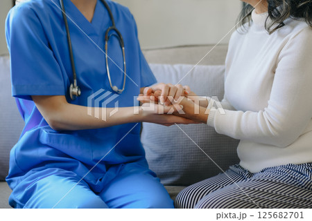 Suffering asian old woman, consulting with psychologist, psychiatrist while patient counseling mental problem. Encouraging, therapy, health care.Psychology, depression. 125682701