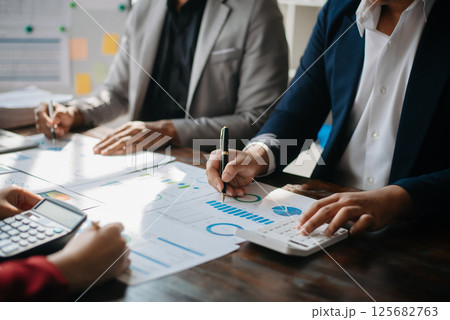 Business People Planning Strategy Analysis Office Concept. writing notes about sticky notes Laptop,tablet  Planning and Brainstorming Strategies of Colleagues 125682763