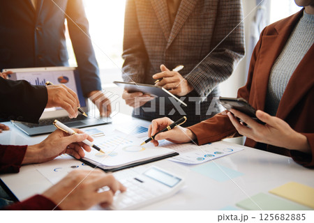 Business People Planning Strategy Analysis Office Concept. writing notes about sticky notes Laptop,tablet  Planning and Brainstorming Strategies in office 125682885