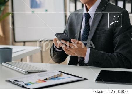 Searching Browsing Internet Data Information Networking Concept with blank search bar.man working with mobile phone and laptop computer VR icon 125683088