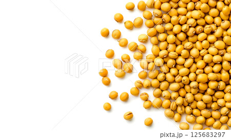 A pile of yellow nuts on a white surface 125683297