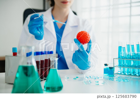 Female biotechnologist testing new chemical substances in a laboratory. Female biotechnologist testing new chemical substances in a laboratory. 125683790