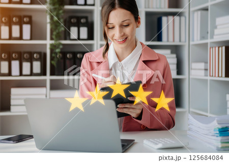 Customer or client the stars to complete five stars. with copy space. giving a five star rating. Service rating, satisfaction concept. 125684084