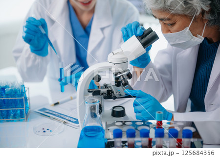 Medical team having a meeting with doctors. Young scientists conducting research investigations 125684356