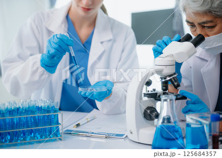 Medical team having a meeting with doctors. Young scientists conducting research investigations Medical team having a meeting with doctors. Young scientists conducting research investigations 125684357