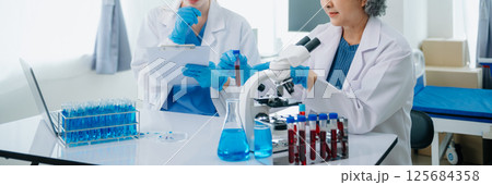 Medical team having a meeting with doctors. Young scientists conducting research investigations 125684358