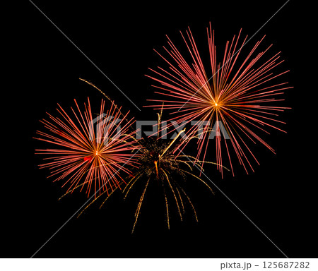 Red firework sparkling on black background for celebration and anniversary 125687282