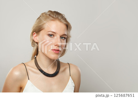 Perfect woman. Female model with blond hairstyle and clean skin, facial treatment Perfect woman. Female model with blond hairstyle and clean skin, facial treatment 125687651