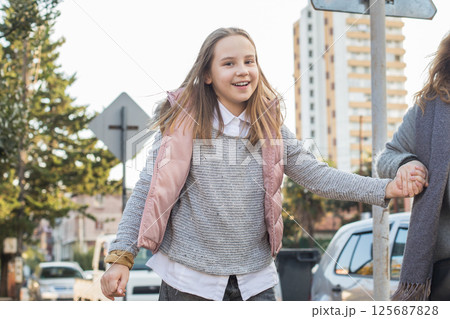 Happy joyful child girl outdoors 125687828