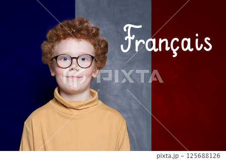 Young boy on French flag with the inscription Francais in French. Education and study language 125688126