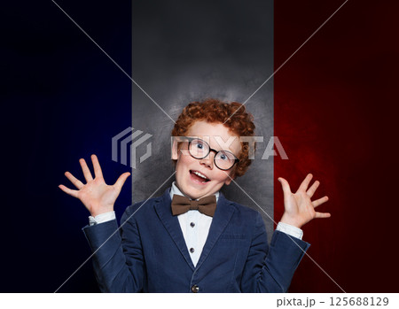 Funny child boy on French flag background. Education, travel, school, camp and study language 125688129