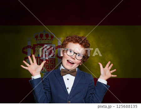 Young child boy having fun on Spanish flag background. Education and childhood in Spain concept Young child boy having fun on Spanish flag background. Education and childhood in Spain concept 125688135