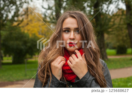 Healthy young woman portrait outdoors 125688627