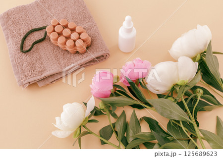 Spa products for facial and body care. Soft terry towel with soap and serum. Spa products for facial and body care. Soft terry towel with soap and serum. 125689623