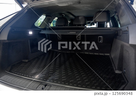 Large black empty car trunk. Open car trunk close up 125690348