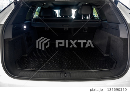 Large black empty car trunk. Open car trunk close up 125690350