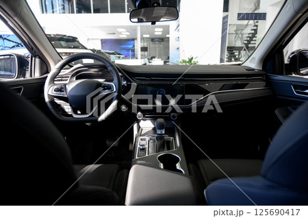 Car interior - steering wheel, shift lever and dashboard. Car modern inside. 125690417