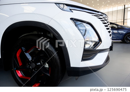Car wheel with brake calipers and stylish design. 125690475