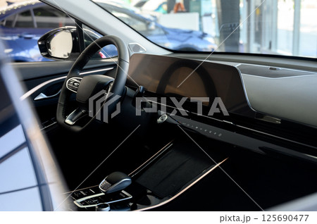 Car interior - steering wheel, shift lever and dashboard. Car modern inside. 125690477