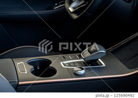 Automatic transmission selector in the interior of a modern car. Automatic transmission selector in the interior of a modern car. 125690492