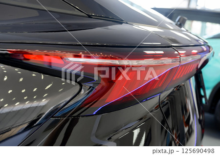 Close up of rear taillight on a vehicle Close up of rear taillight on a vehicle 125690498