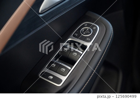 Car door with door handle and window control and adjustment button Car door with door handle and window control and adjustment button 125690499