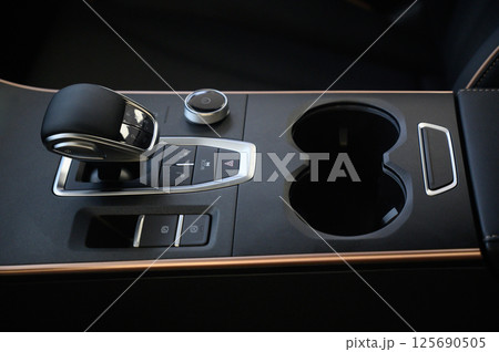 Automatic transmission selector in the interior of a modern car. Automatic transmission selector in the interior of a modern car. 125690505