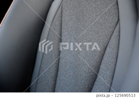 Close-up of black leather seat of modern car Close-up of black leather seat of modern car 125690513