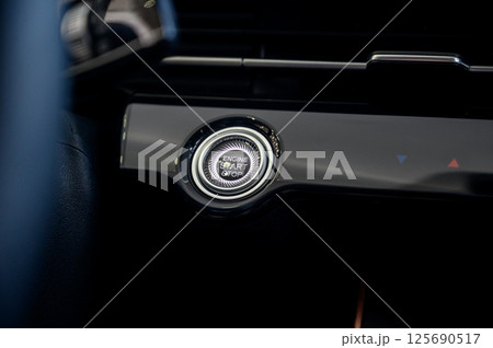 Car engine start button. Car interior. Car electronics. Car engine start button. Car interior. Car electronics. 125690517